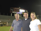 Lisa, Tripp, Chris on the field at Bryant-Denny Stadium in Tuscaloosa