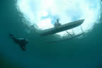 Diver (Paul Waldeck) and canoe.