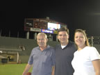 Lisa, Tripp, Chris on the field at Bryant-Denny Stadium in Tuscaloosa